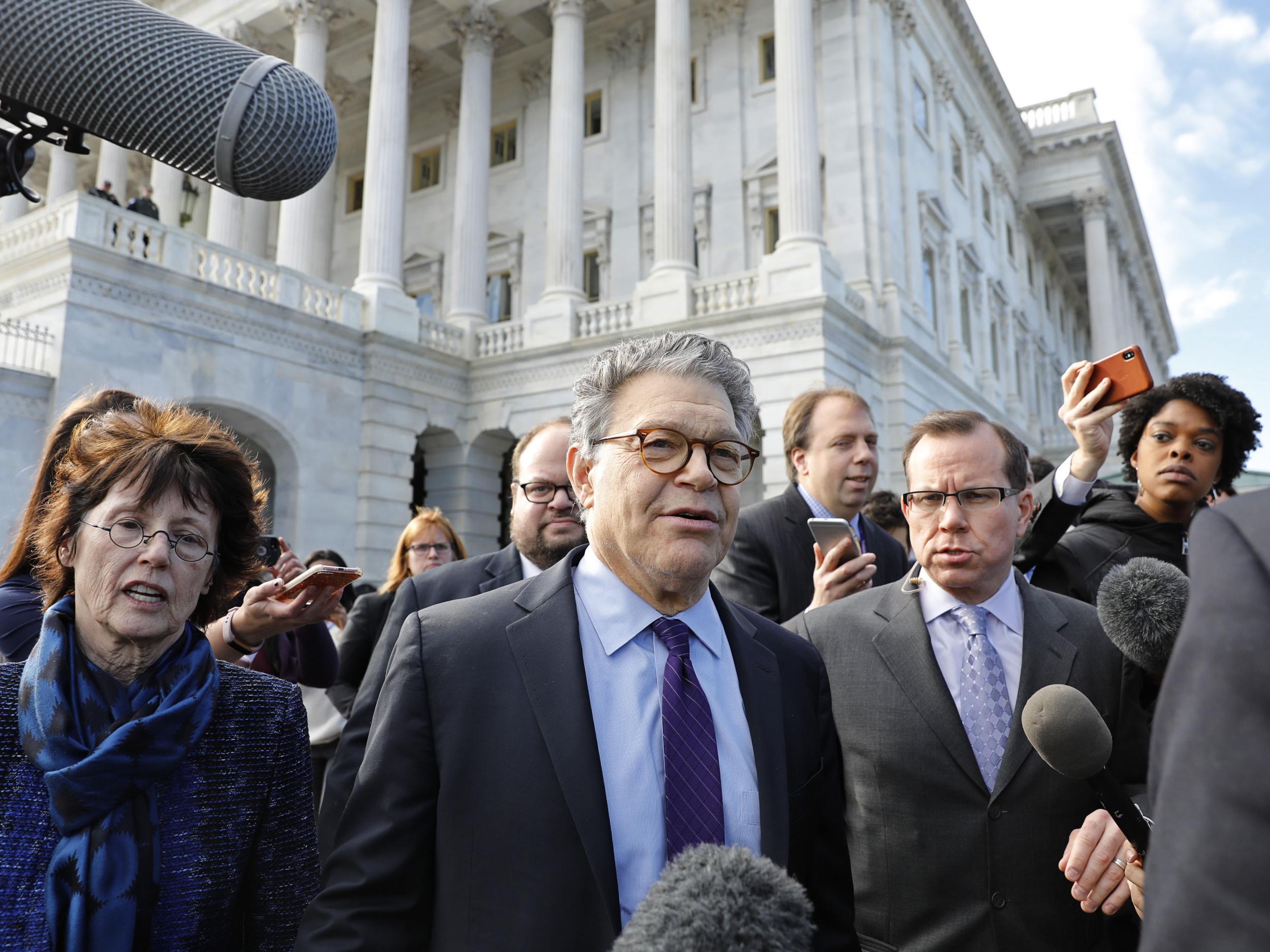 US Senator Al Franken (D-MN) departs the U.S. Capitol with his wife Franni after announcing his resignation over allegations of sexual misconduct