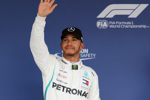 Mercedes driver Lewis Hamilton of Britain waves to spectators