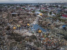 Indonesia may turn earthquake-hit zones into mass graves