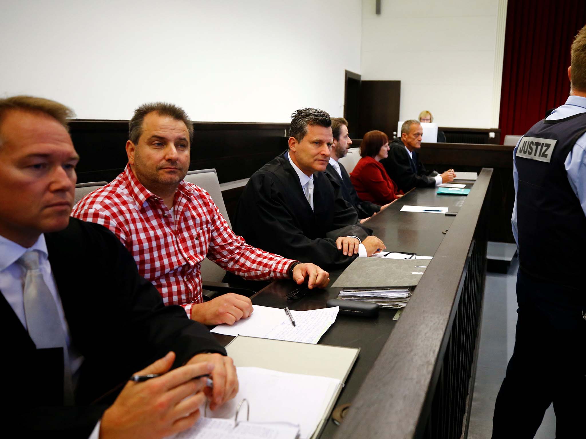 Wilfried, in checked shirt, awaits the verdict