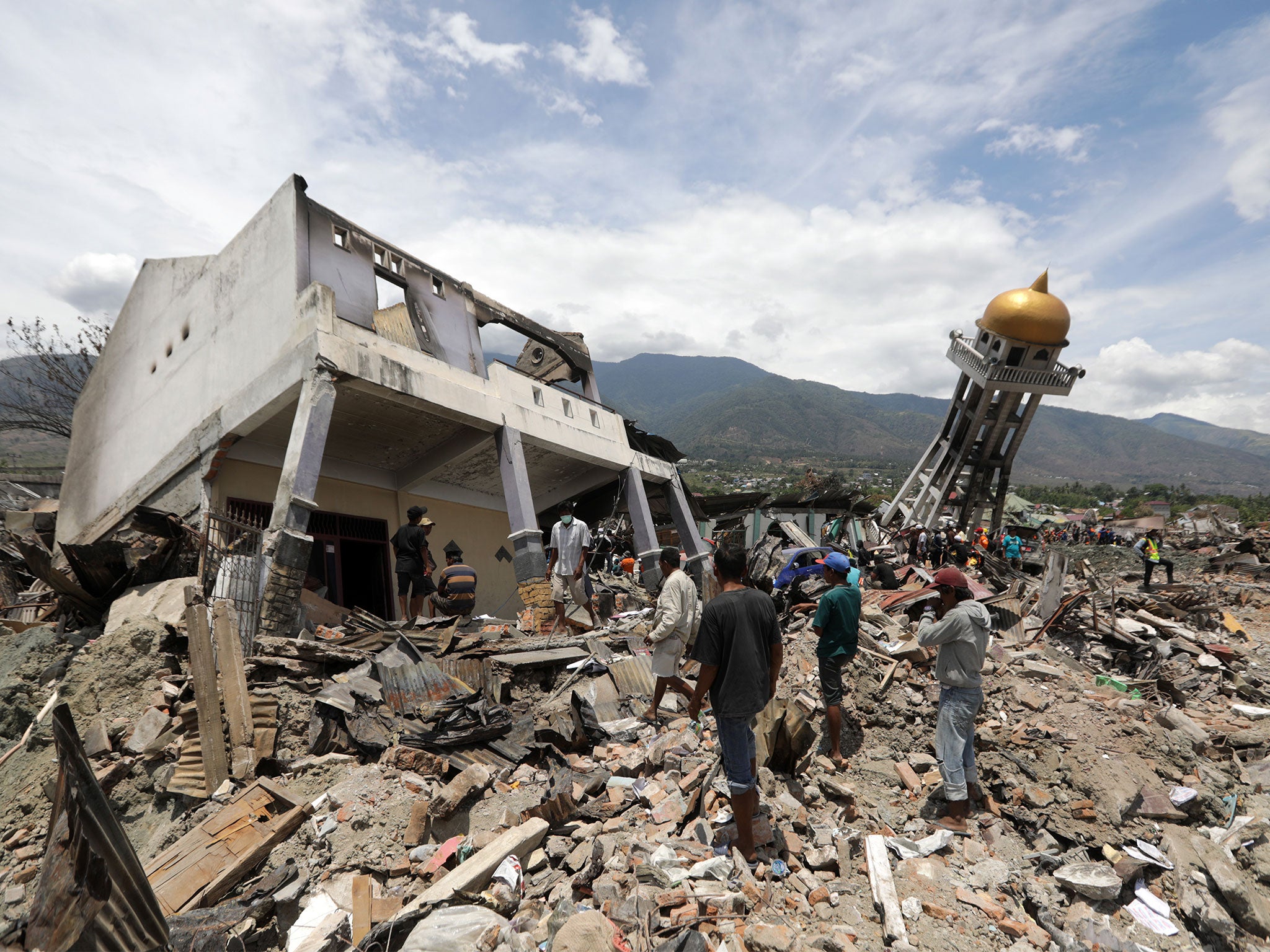 Indonesia earthquake death toll rises to 1,948 | The Independent