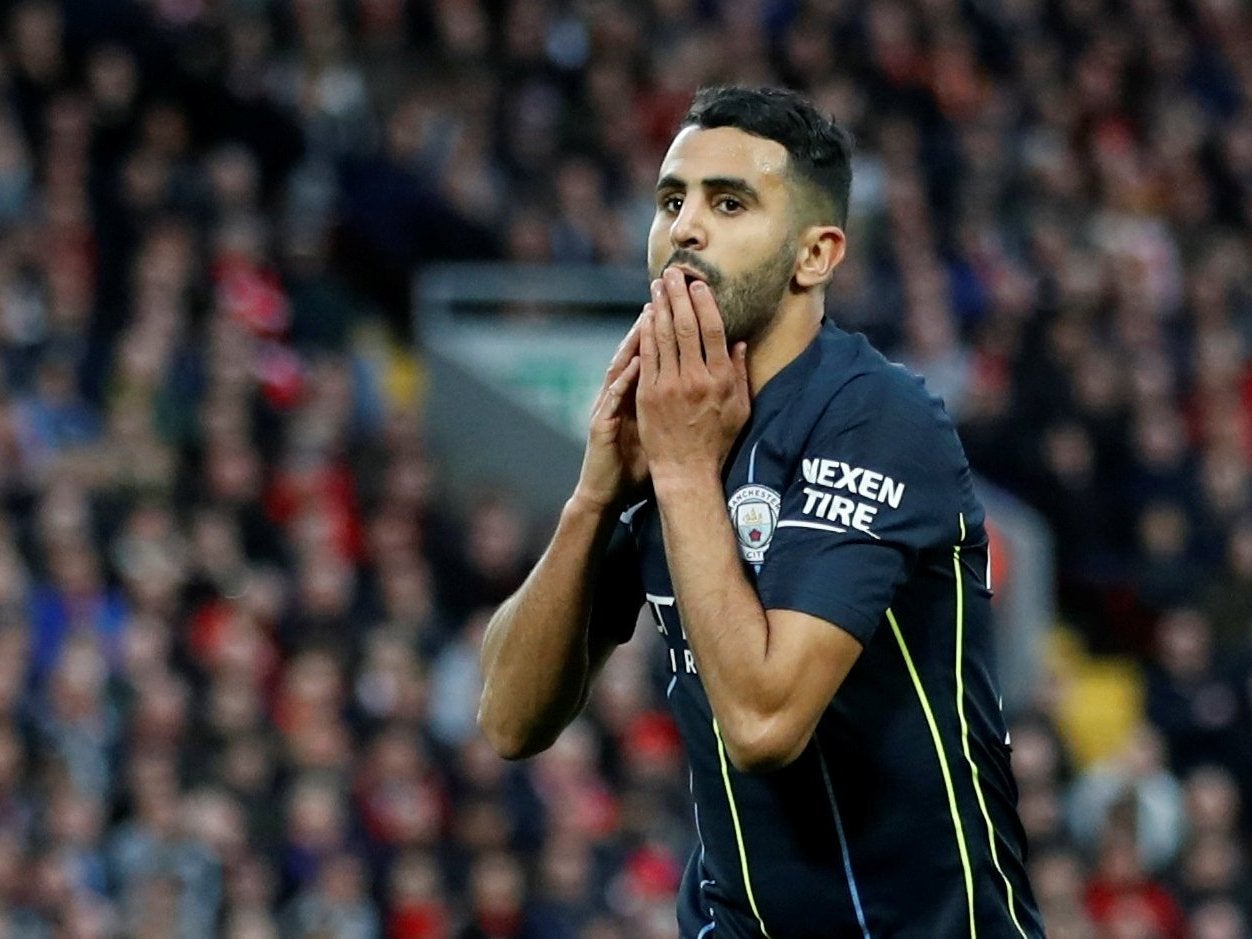 Mahrez reacts to his missed spot-kick (Reuters)