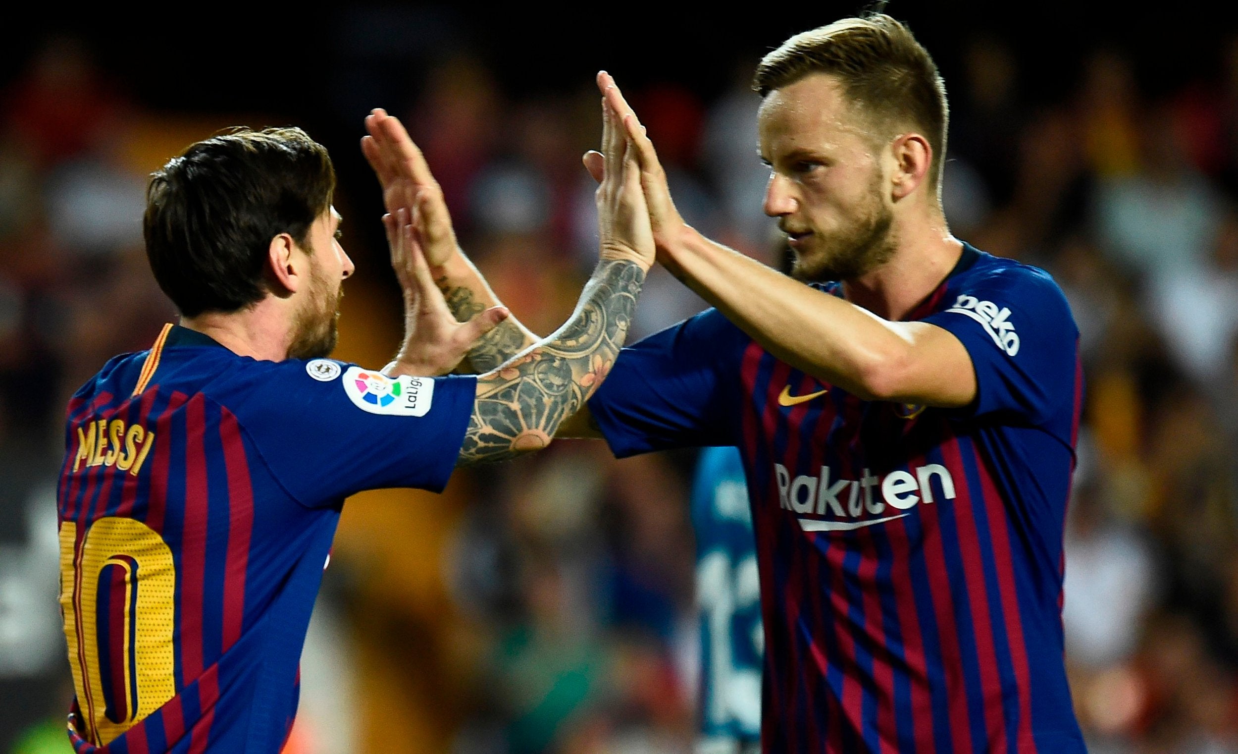 Lionel Messi and Ivan Rakitic celebrate