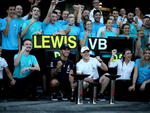 Lewis Hamilton and Valtteri Bottas celebrate with their team