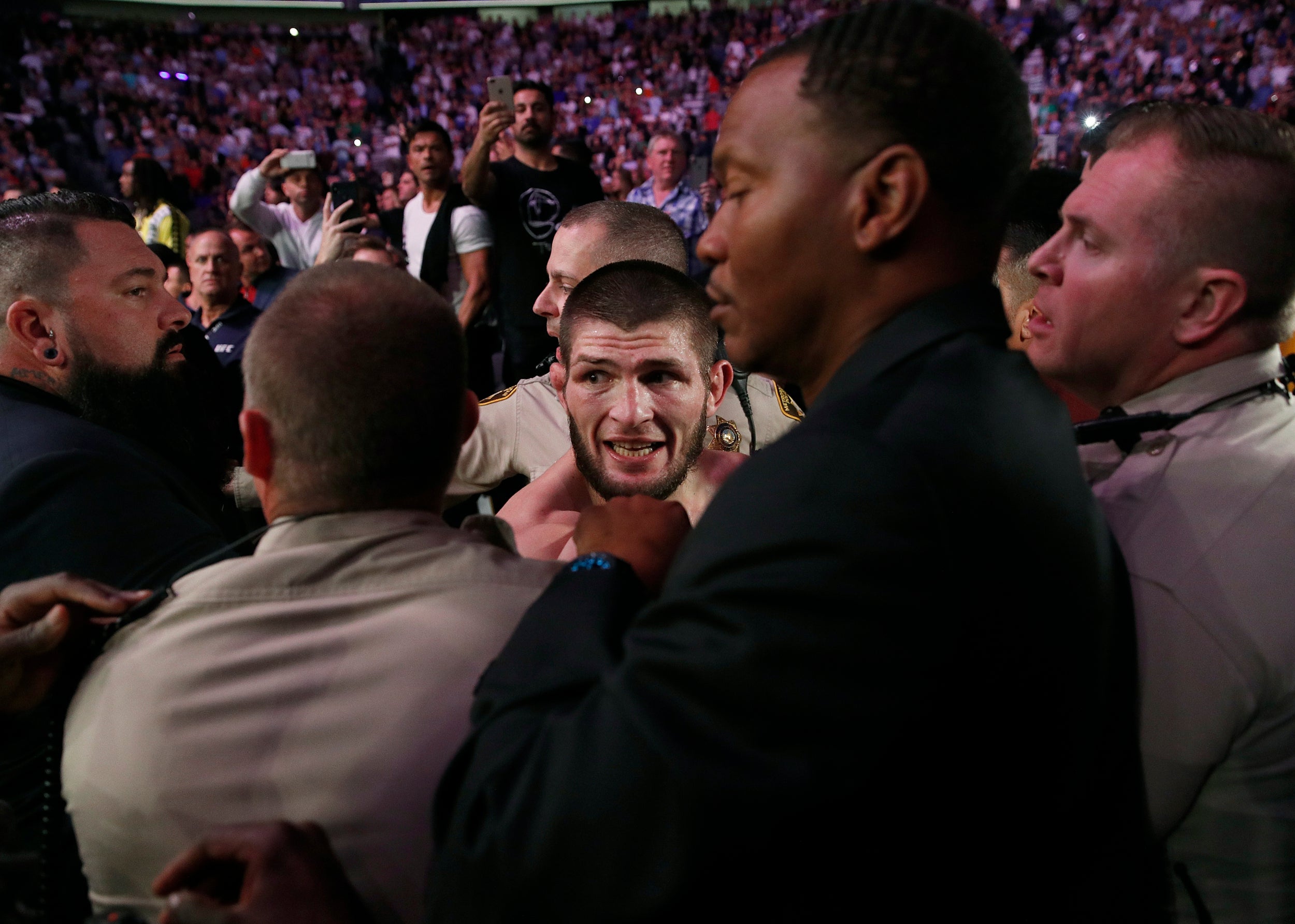 Khabib is restrained after the fight