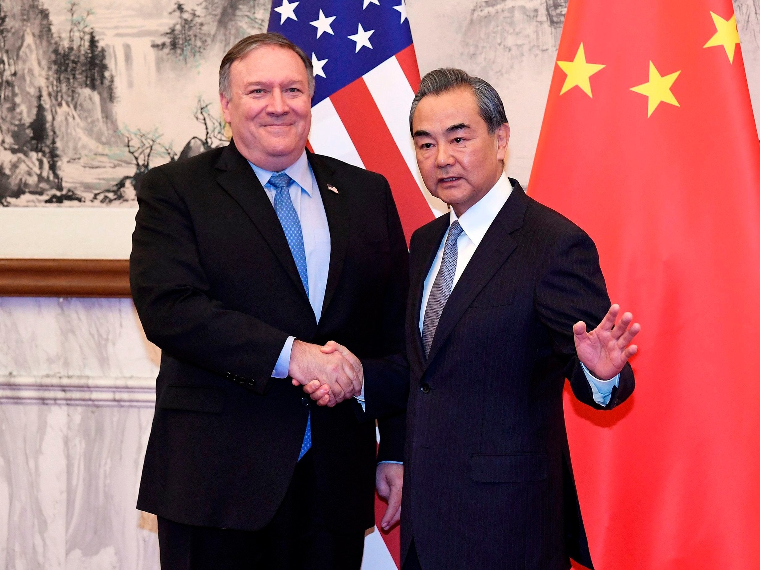 Mike Pompeo with China’s foreign minister Wang Yi in Beijing (AFP/Getty)