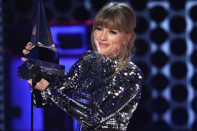 Taylor Swift accepts the award for artist of the year at the American Music Awards