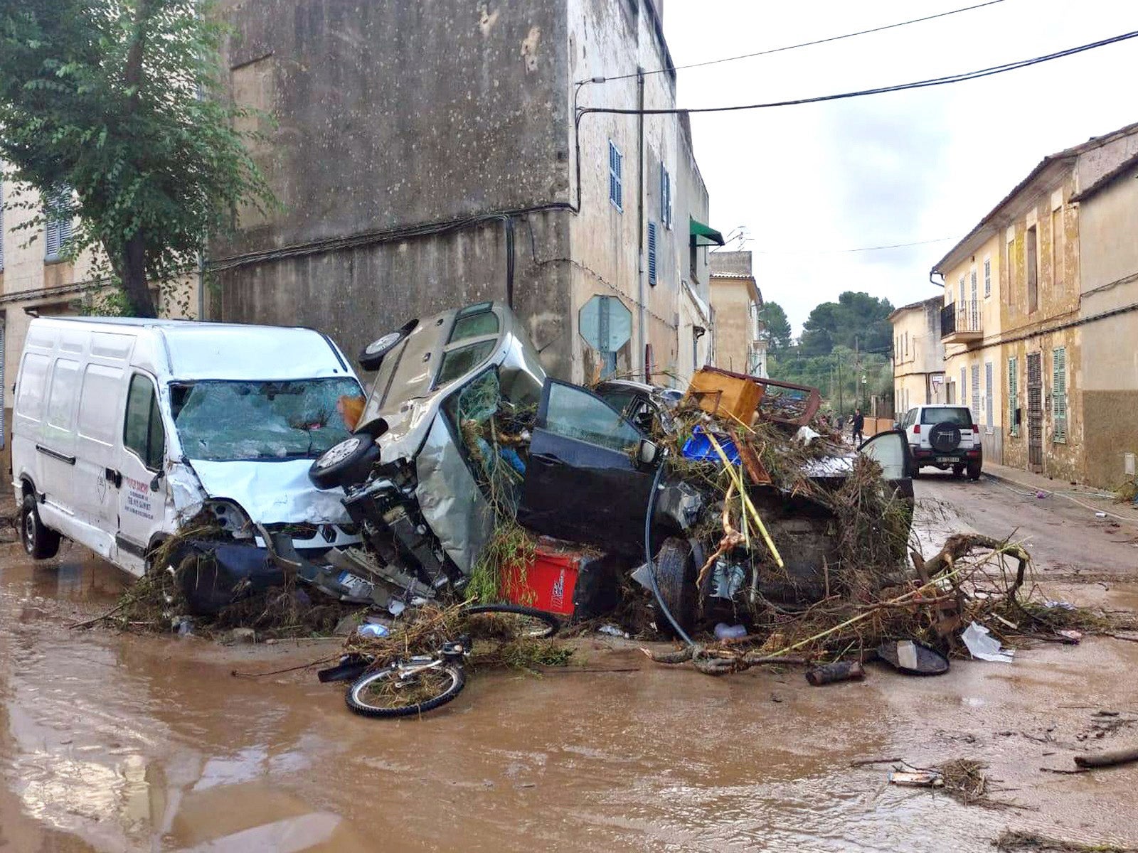 Several vehicles were destroyed after a flash flood hit the village of Sant Llorenc des Cardasar