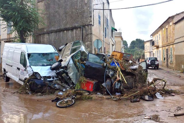Several vehicles were destroyed after a flash flood hit the village of Sant Llorenc des Cardasar