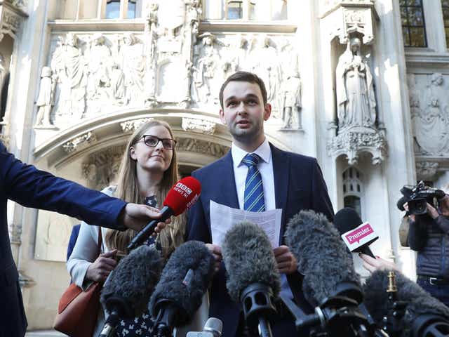 Daniel and Amy McArthur, who own Ashers Bakery in Belfast, speak at the Supreme Court in London - news agency photographers were also present to document their victory