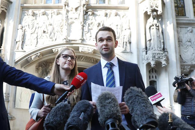 Daniel and Amy McArthur, who own Ashers Bakery in Belfast, speak at the Supreme Court in London - news agency photographers were also present to document their victory