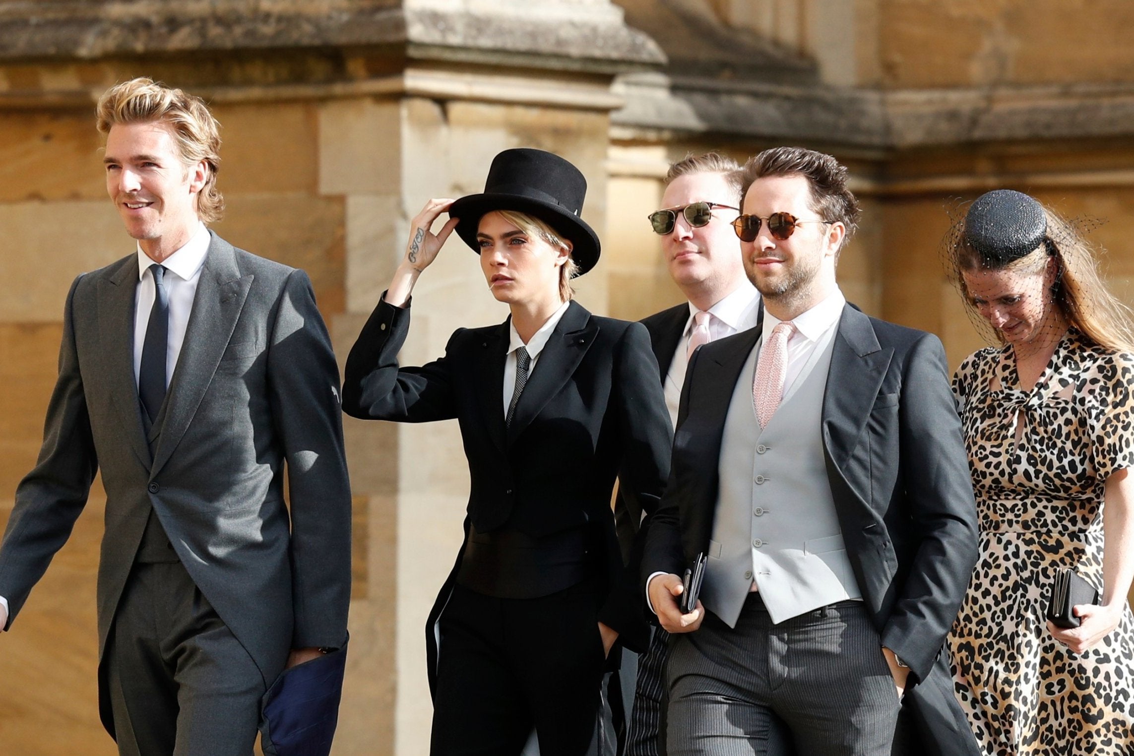 Cara Delevingne arrives to attend the wedding of Princess Eugenie of York and Jack Brooksbank