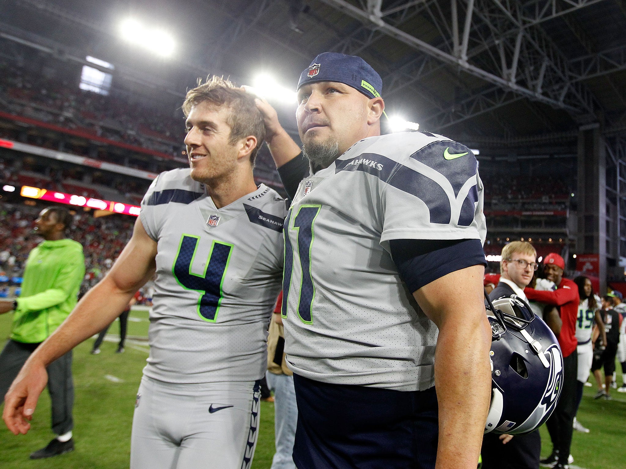 Dickson (left) pictured with Seattle kicker Sebastian Janikowski (Getty )