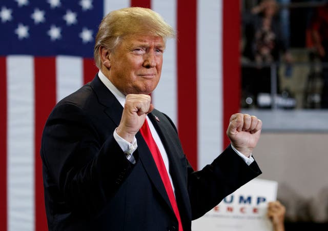 President Donald Trump arrives to speak at a campaign rally at Erie Insurance Arena