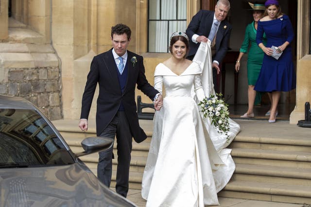 The couple drove off in an Aston Martin DB10 (Getty)