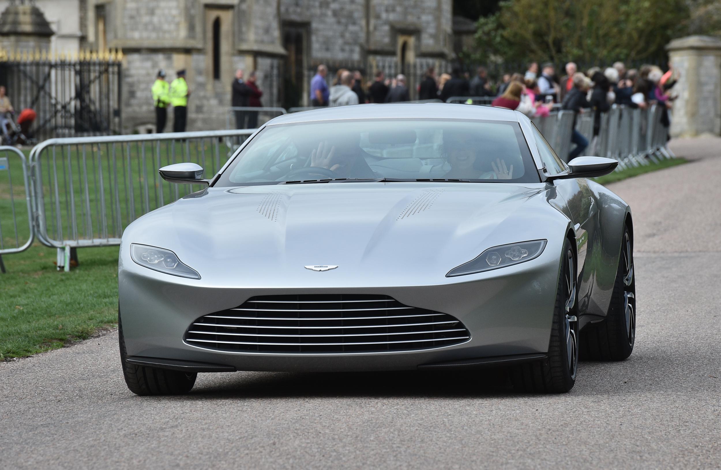 The couple left for the evening reception in an Aston Martin DB10 (Getty)
