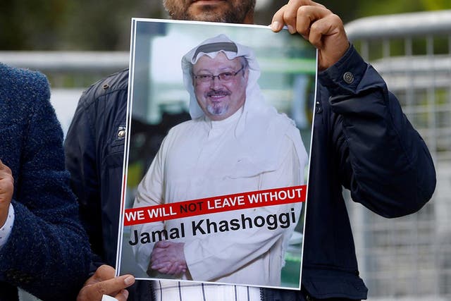 <p>Protesters in Istanbul hold a picture of the missing journalist outside the Saudi consulate</p>