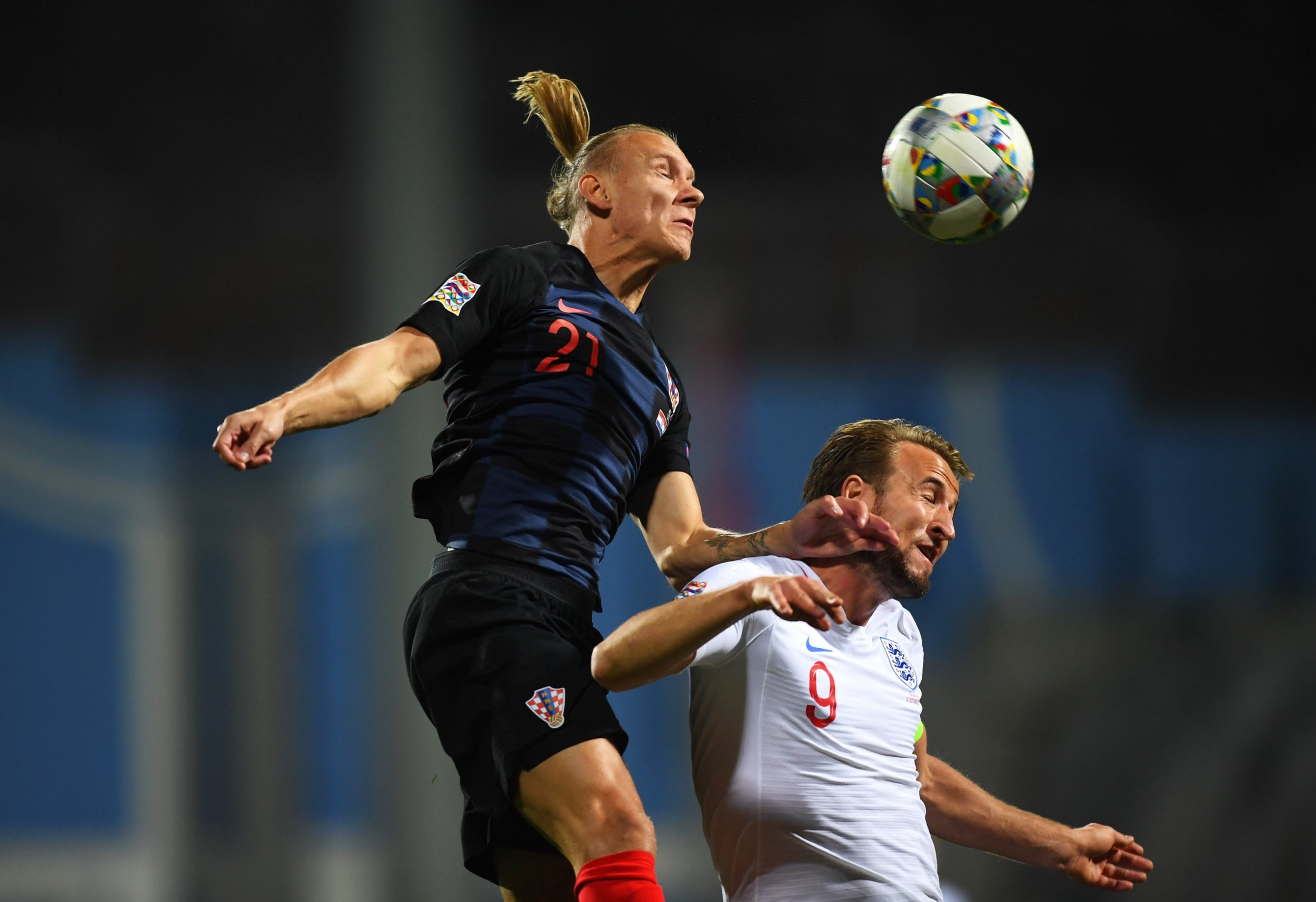 Harry Kane challenges in the air