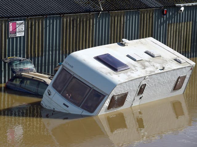 A car and motor home caught in flood water after Storm Callum passed through the town of Carmarthen, west Wales, 14 October, 2018