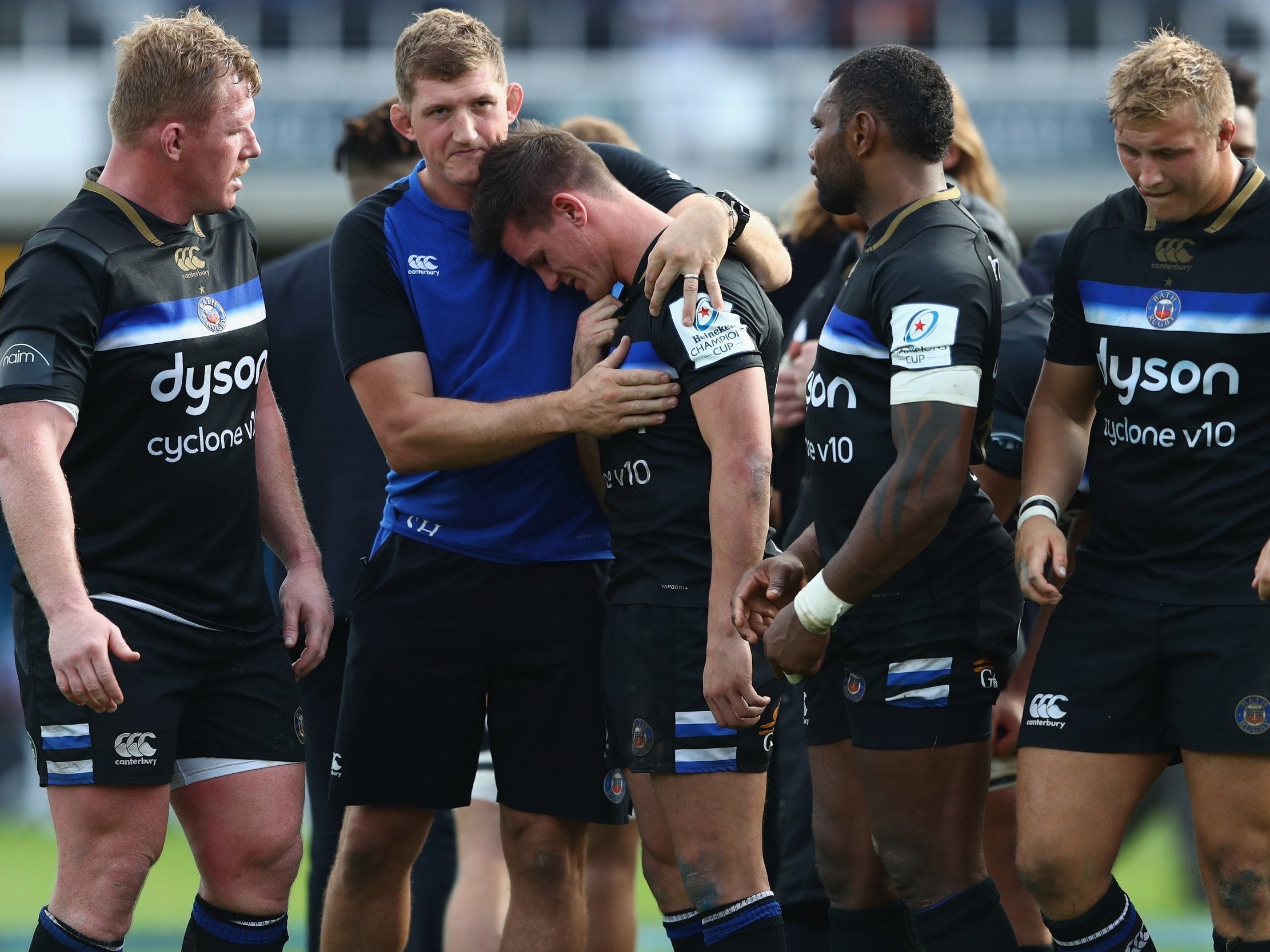 Freddie Burns was consoled by his Bath teammates after his late howler against Toulouse