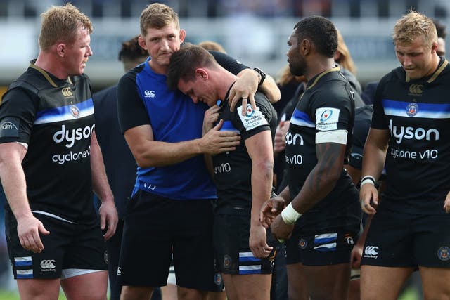 Freddie Burns was consoled by his Bath teammates after his late howler against Toulouse