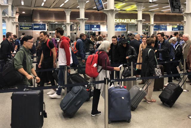 On time? Passengers queuing for check-in at the Eurostar terminal at London St Pancras