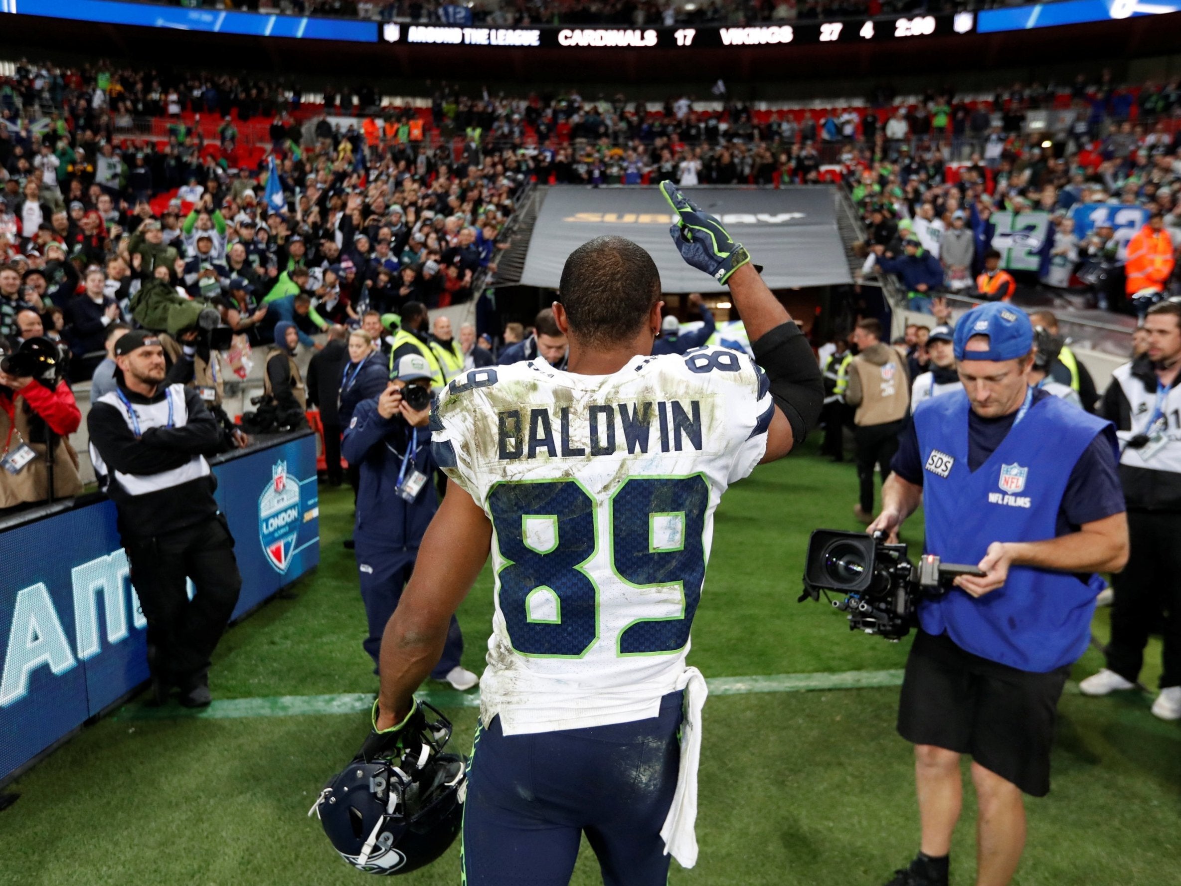 Doug Baldwin salutes the Wembley crowd as he leaves the field