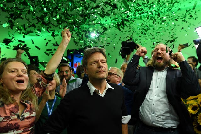 Leaders of the German Green party (Die Gruenen), Henrike Hahn, Robert Habeck and Anton Hofreiter react after to the first exit polls in the Bavarian state elections in Munich