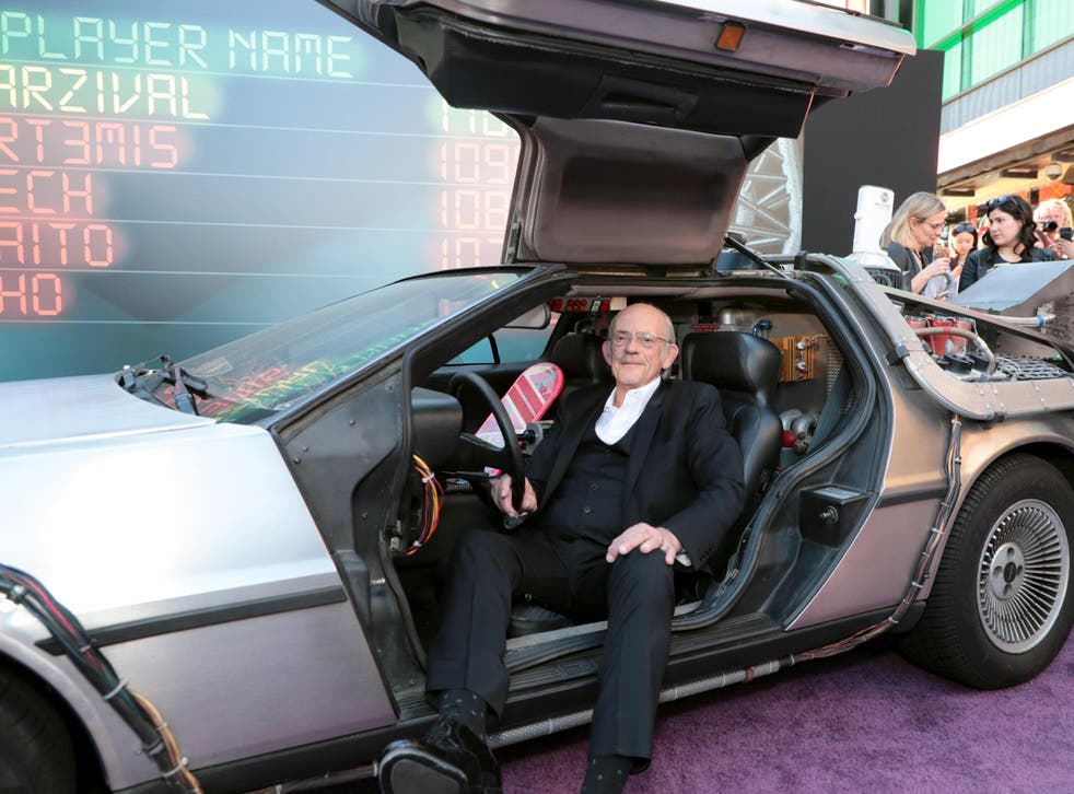 Christopher Lloyd, who played Dr Emmett Brown in the 1985 film, sits in the famous DeLorean car from the original movies