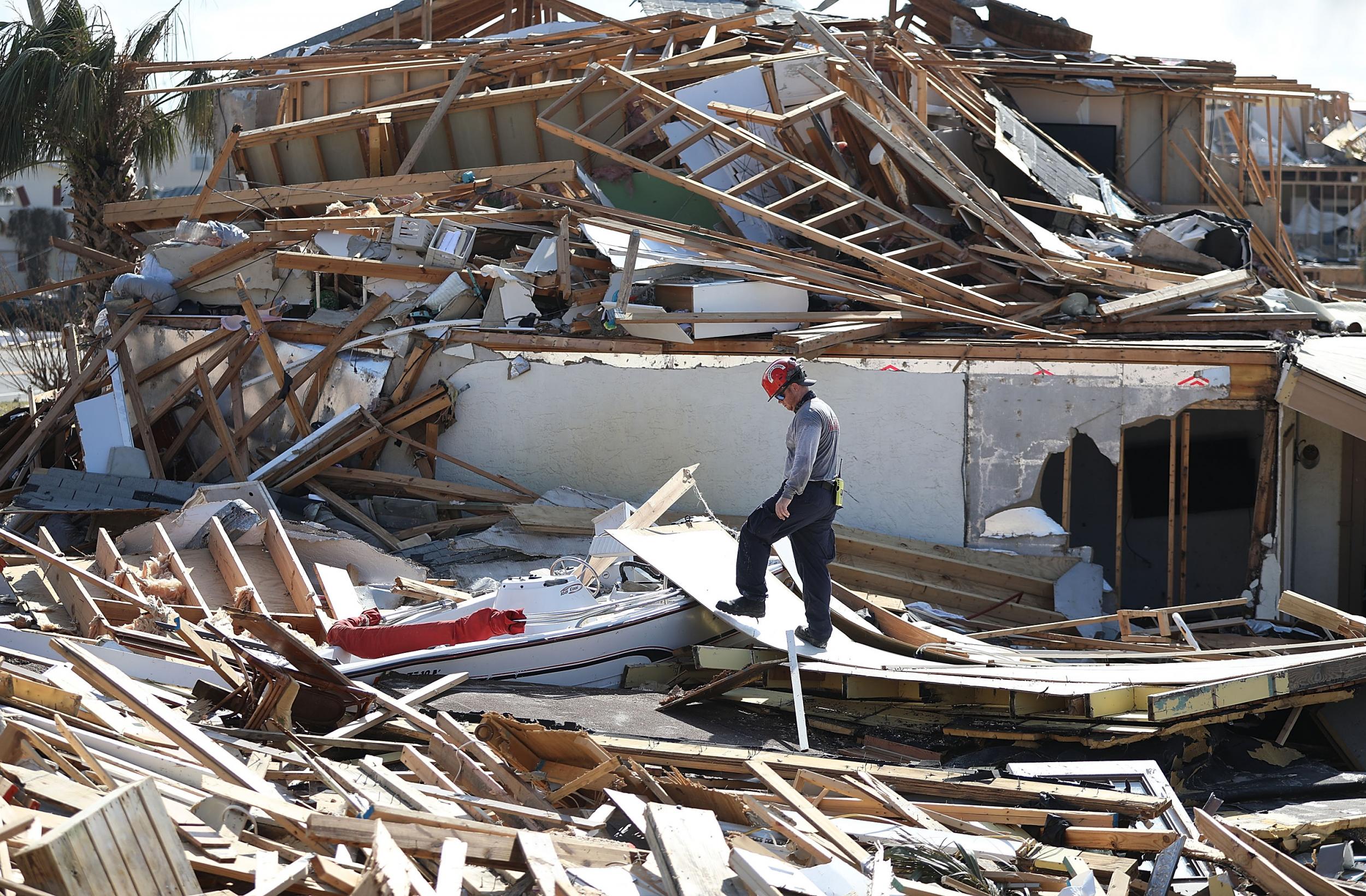 A rescue worker continues his work of searching Mexico Beach, Florida, after hurricane Michael passed through as a Category 4 storm.