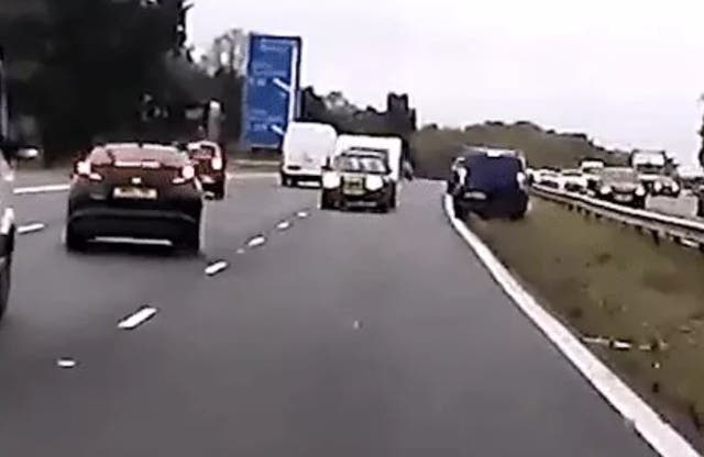 Car towing a caravan speeds wrong way up motorway before colliding with two vehicles
