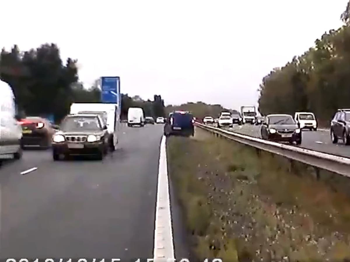 M40 crash video shows car towing caravan wrong way down motorway | The ...