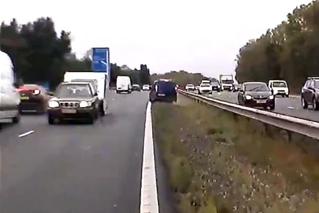 The car towing a caravan driving the wrong way along the M40