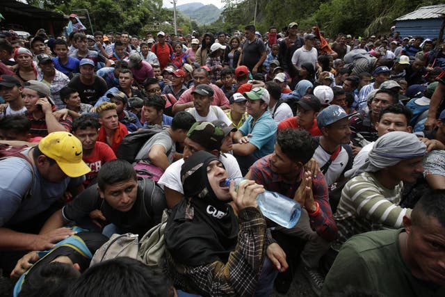 Hundreds of Hondurans moved through at the border crossing in Agua Caliente, Guatemala, 15 October 2018 on their way to Mexico and the US border