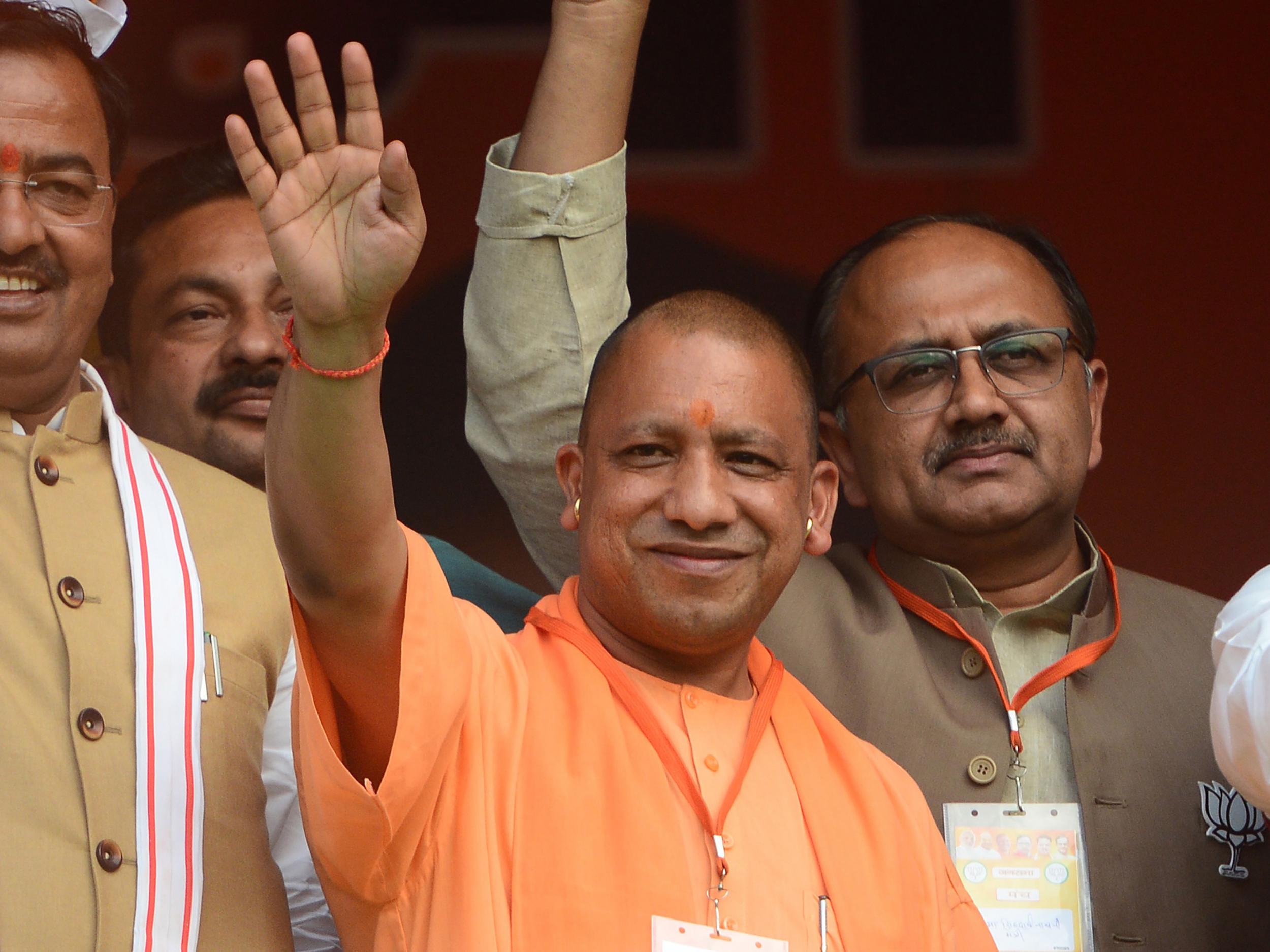 Uttar Pradesh's cabinet, which is led by a hardline Hindu nationalist preacher Yogi Adityanath (centre), agreed the proposal in the face of protests from opposition parties