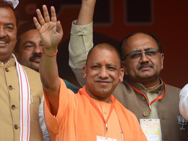 <p>Chief minister of Uttar Pradesh, Yogi Adityanath waves during a public meeting for BJP's candidate for the by poll to Phulpur (Allahabad) Lok Sabha seat in Allahabad on 8 March 2018</p>