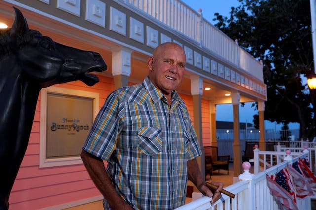 Dennis Hof poses outside his Moonlite BunnyRanch legal brothel in Mound House, Nevada