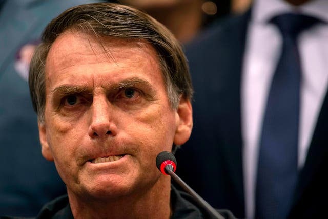 Brazil's right-wing presidential candidate for the Social Liberal Party (PSL) Jair Bolsonaro gestures during a press conference in Rio de Janeiro