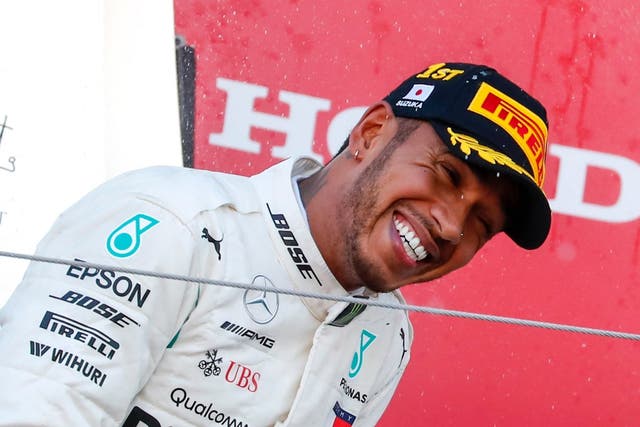 Lewis Hamilton of Mercedes AMG GP celebrates on the podium