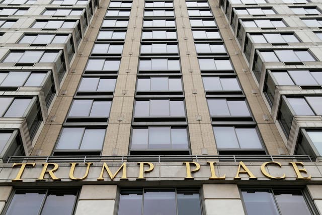 Gold letters spell out "Trump Place" on the front of a New York City condominium building