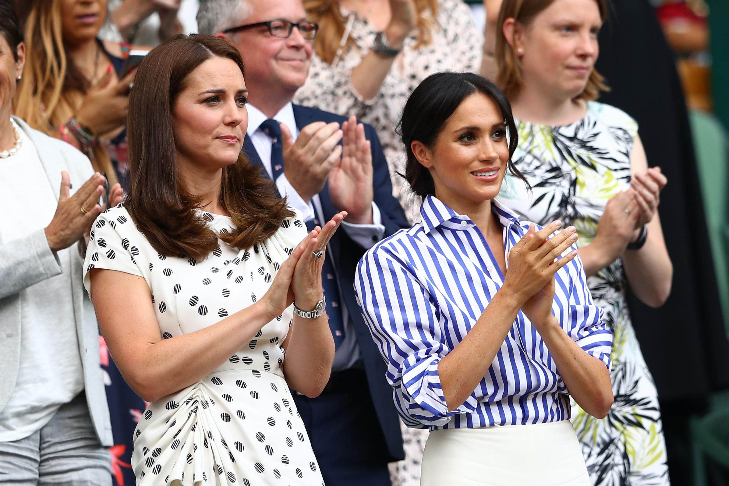 The Duchess of Cambridge and the Duchess of Sussex attending the Women's Singles Final at Wimbledon 2018, watching Serena Williams play Angelique Kerber