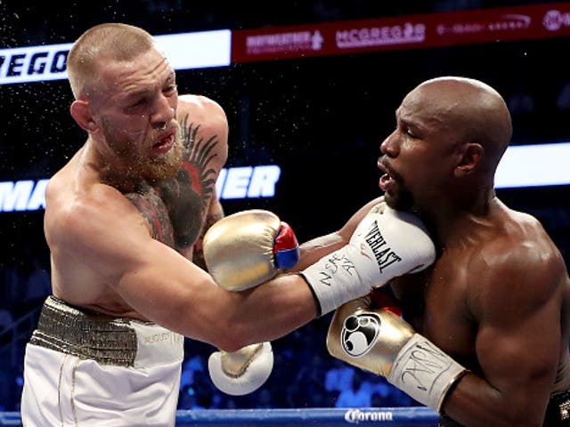 <p>Conor McGregor (left) and Floyd Mayweather in their 2017 boxing match </p>