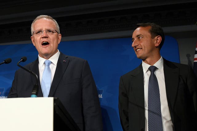 Australian Prime Minister Scott Morrison, left, speaks next to Liberal candidate Dave Sharma at a Liberal Party Wentworth by-election function in Double Bay in Sydney