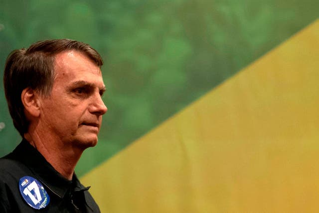 Brazil's right-wing presidential candidate for the Social Liberal Party (PSL) Jair Bolsonaro gestures during a press conference in Rio de Janeiro