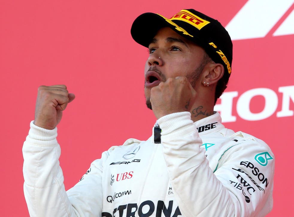 Lewis Hamilton celebrates winning a fifth world championship