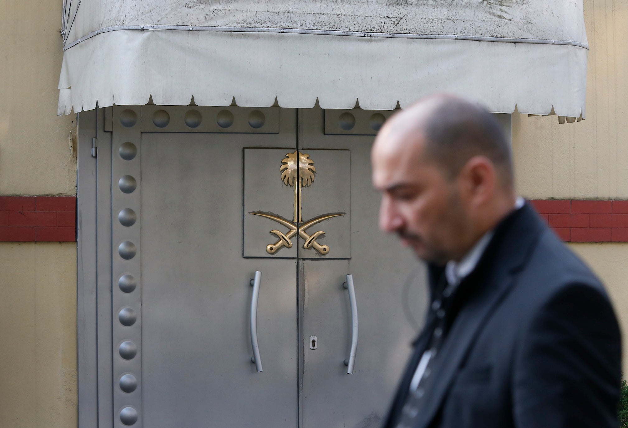 Security personnel guard Saudi Arabia's consulate in Istanbul, Monday, Oct. 22, 2018.