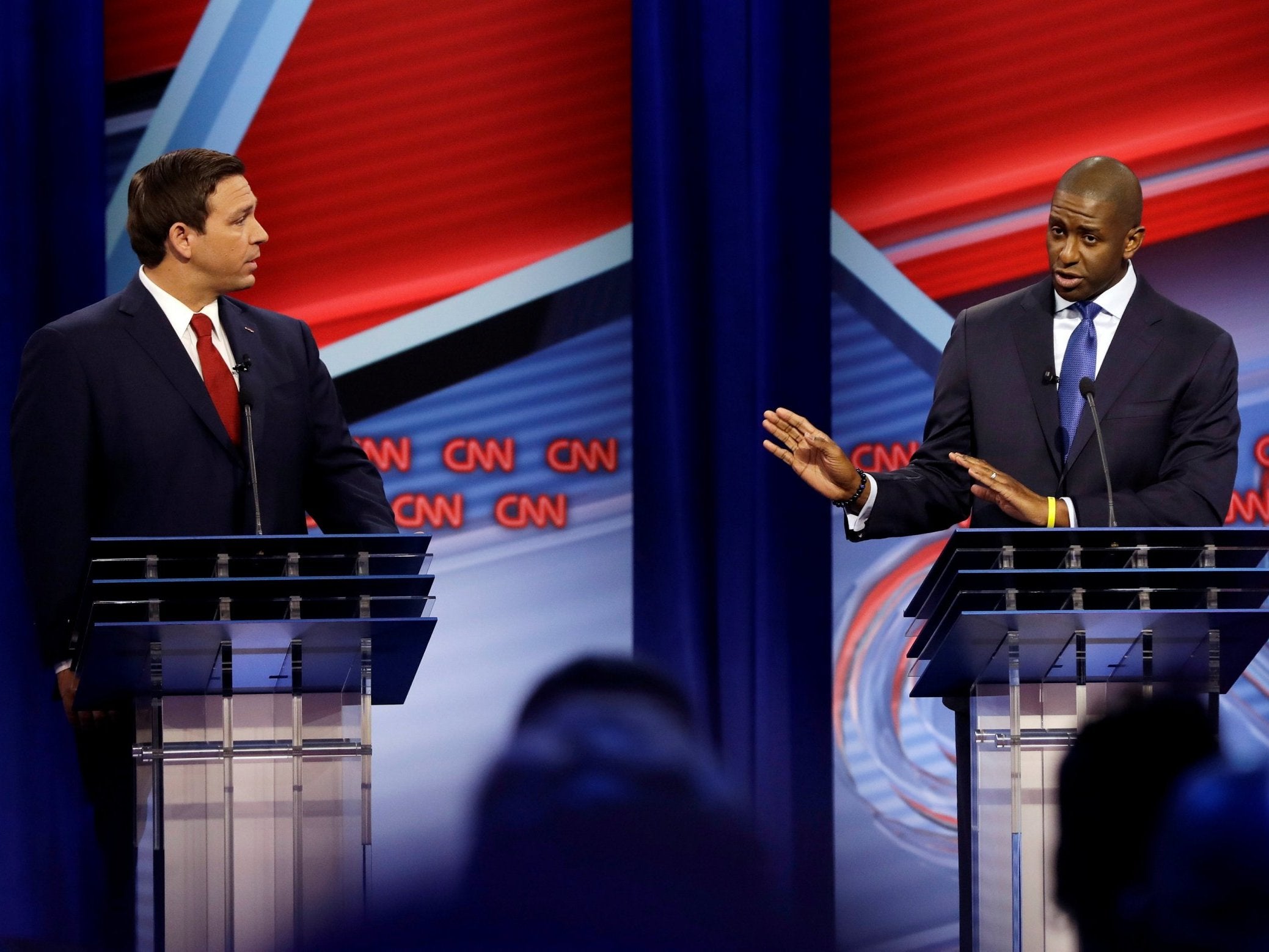 Ron DeSantis and Andrew Gillum lock horns in their first televised debate (Reuters)