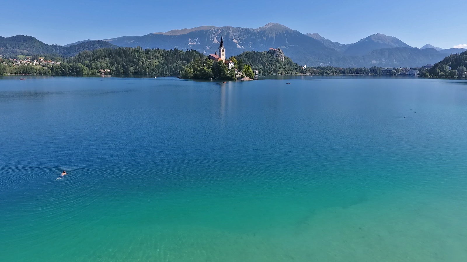 Participants swim in some of Slovenia’s most beautiful lakes
