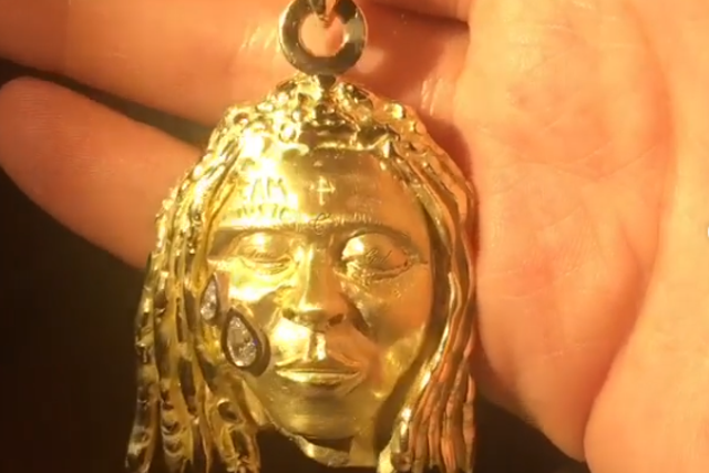 A gold pendant depicting US rapper Lil Wayne