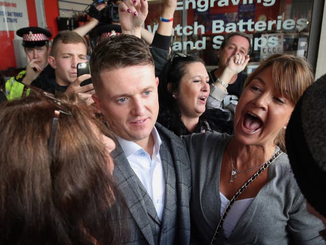 Tommy Robinson surrounded by supporters outside City Thameslink railway station, after the former English Defence League leader left the Old Bailey where his contempt of court case was adjourned in September